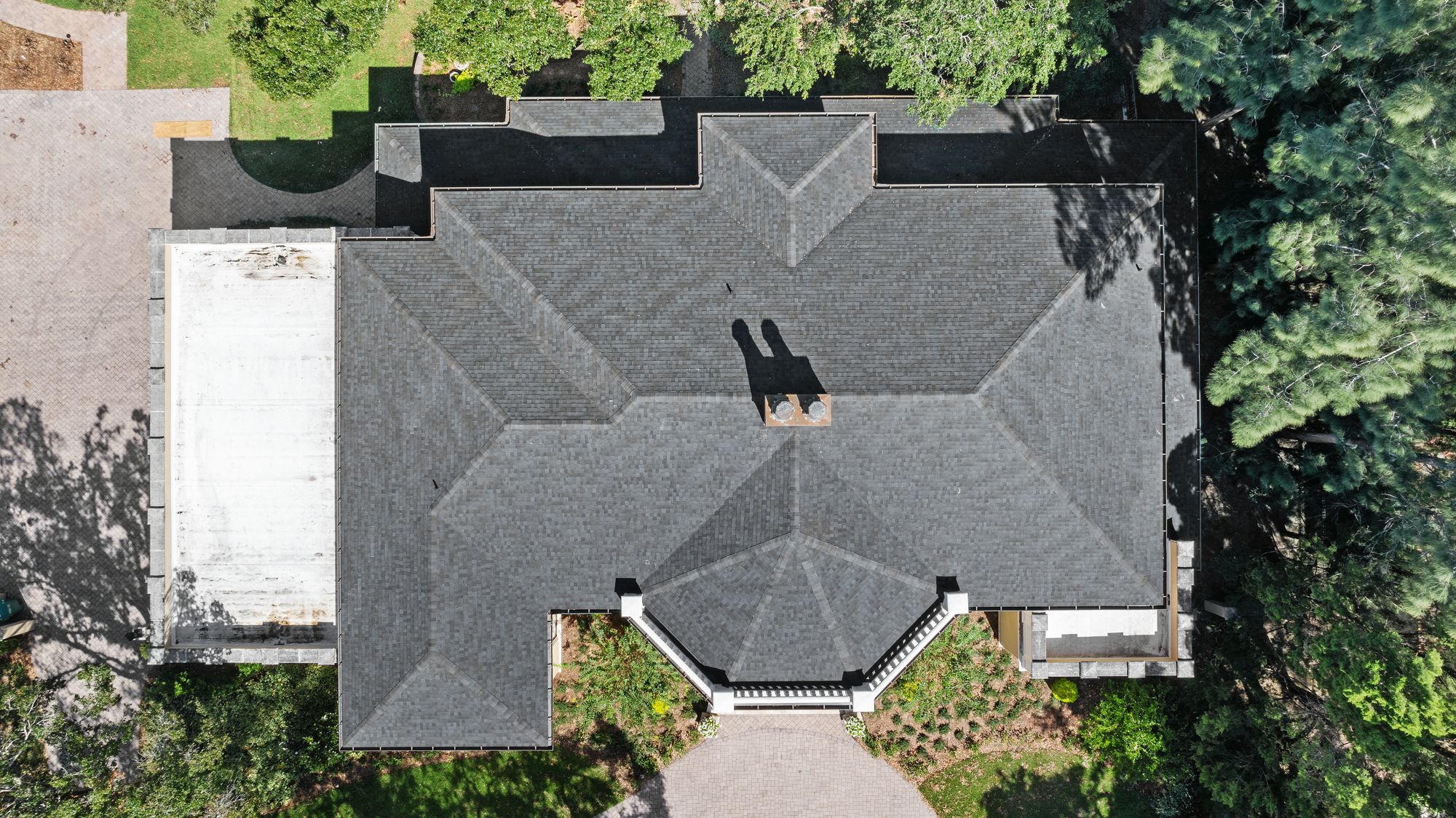 Shingle roof replacement on a large home in Tampa, FL by Primmer Roofing