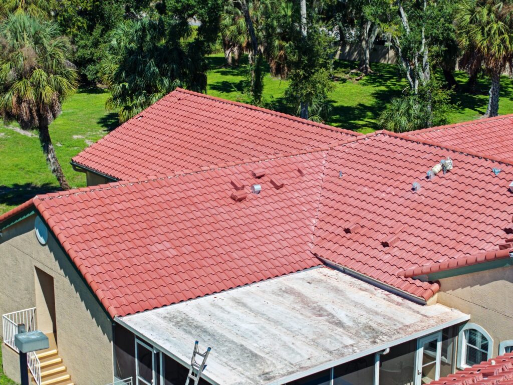 Flat roof section beside tile where water can pond